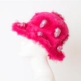 pink fluffy hat with pink dolls headpiece