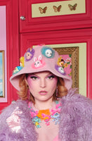 pink fluffy  hat with animal dolls headpiece