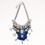 miniature doll face necklace with blue tassels & silver hands