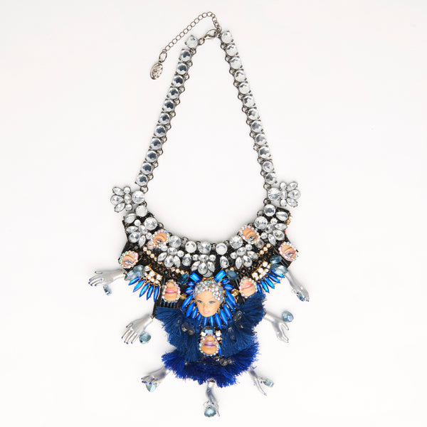 miniature doll face necklace with blue tassels & silver hands
