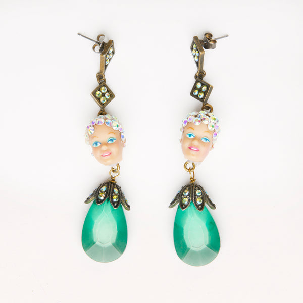miniature sparkly dolls heads with green crystal beads