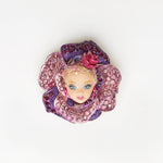 miniature blond doll face brooch with fuchsia flower - floral collection