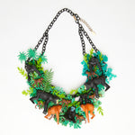 monkeys plastron necklace with luxuriant vegetation in the jungle