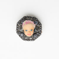 miniature blond with pink hair baroque doll face ring with grey gemestones