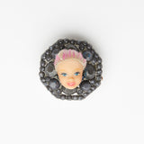 miniature blond with pink hair baroque doll face ring with grey gemestones