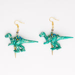 green iridescent t-rex  dinosaur earrings with golden spike