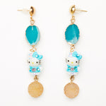 blue hello kitty toy earrings with blue gemstones