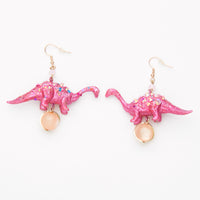 pink iridescent diplodocus dinosaur earrings with round beads
