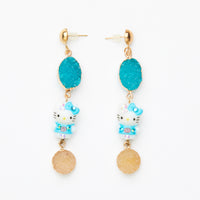 blue hello kitty toy earrings with blue gemstones