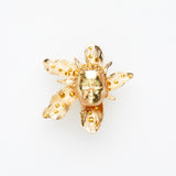 gold miniature doll face on gold flower ring - christmas