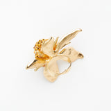 gold miniature doll face on gold flower ring - christmas