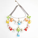 teletubbies toys necklace on geometrical base