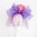 pink hair disco doll on purple bow hat headpiece with net