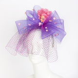 pink hair disco doll on purple bow hat headpiece with net