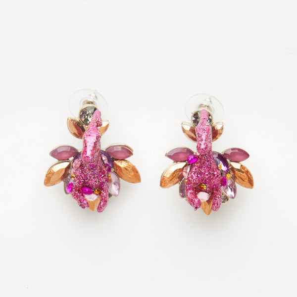 pink iridescent parasaurolophus dinosaur earrings on gemstones base