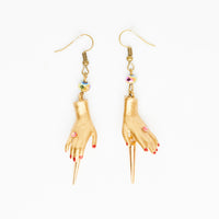 golden spike earrings with gold dolls hands