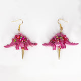 pink iridescent stegosaurus dinosaur earrings with gold spike